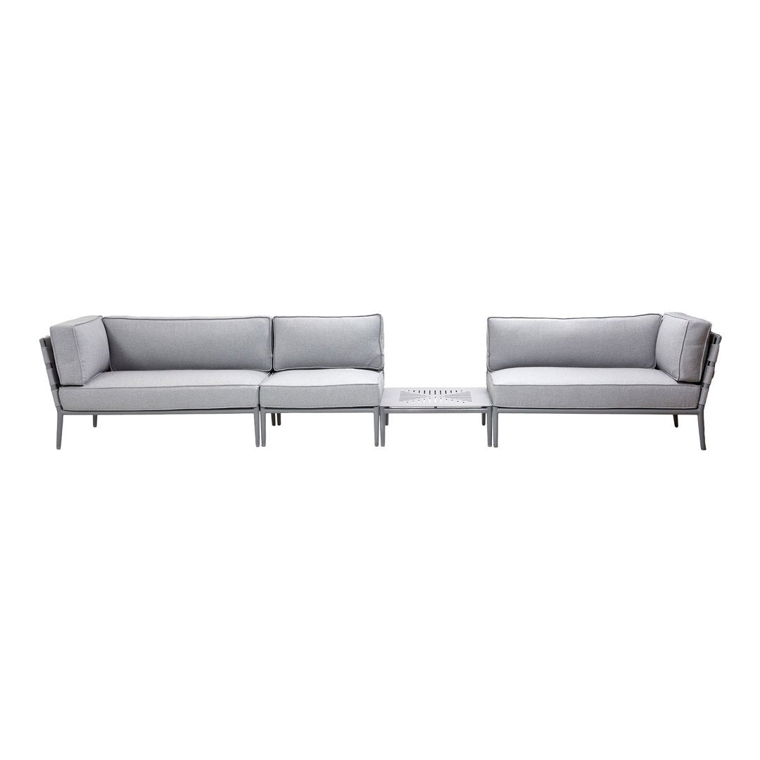 Gray outdoor sofa set with sleek lines and subtle patterns, featuring a minimalist design and metal accents.