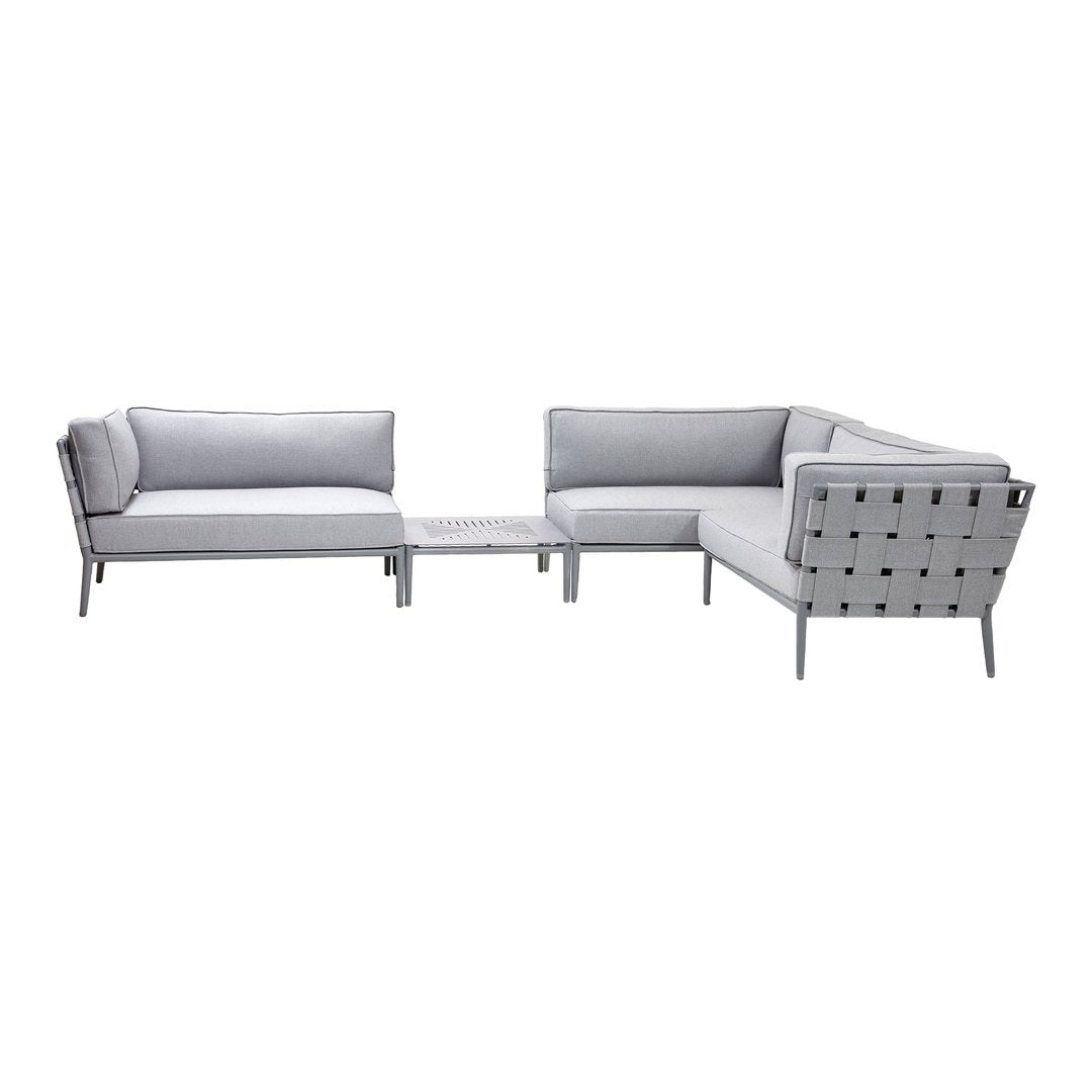Stylish gray outdoor sectional sofa with sleek metal accents and a modern geometric pattern.