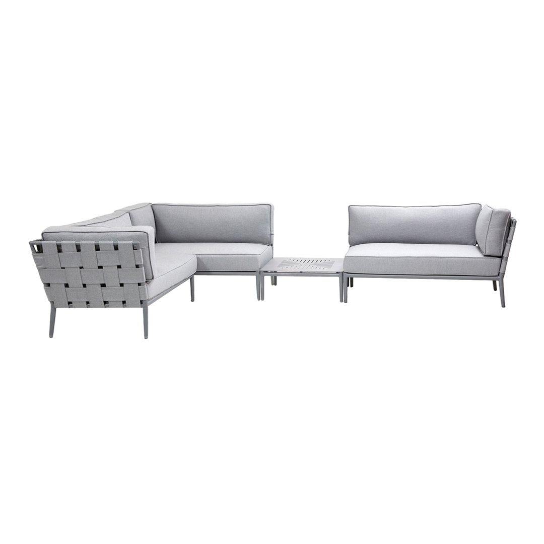 Gray outdoor sectional sofa with sleek lines, minimalist design, and matching coffee table. Perfect for modern patios.