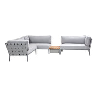 Stylish gray outdoor sectional sofa with a modern design and natural wood accent table. Perfect for any patio or garden.