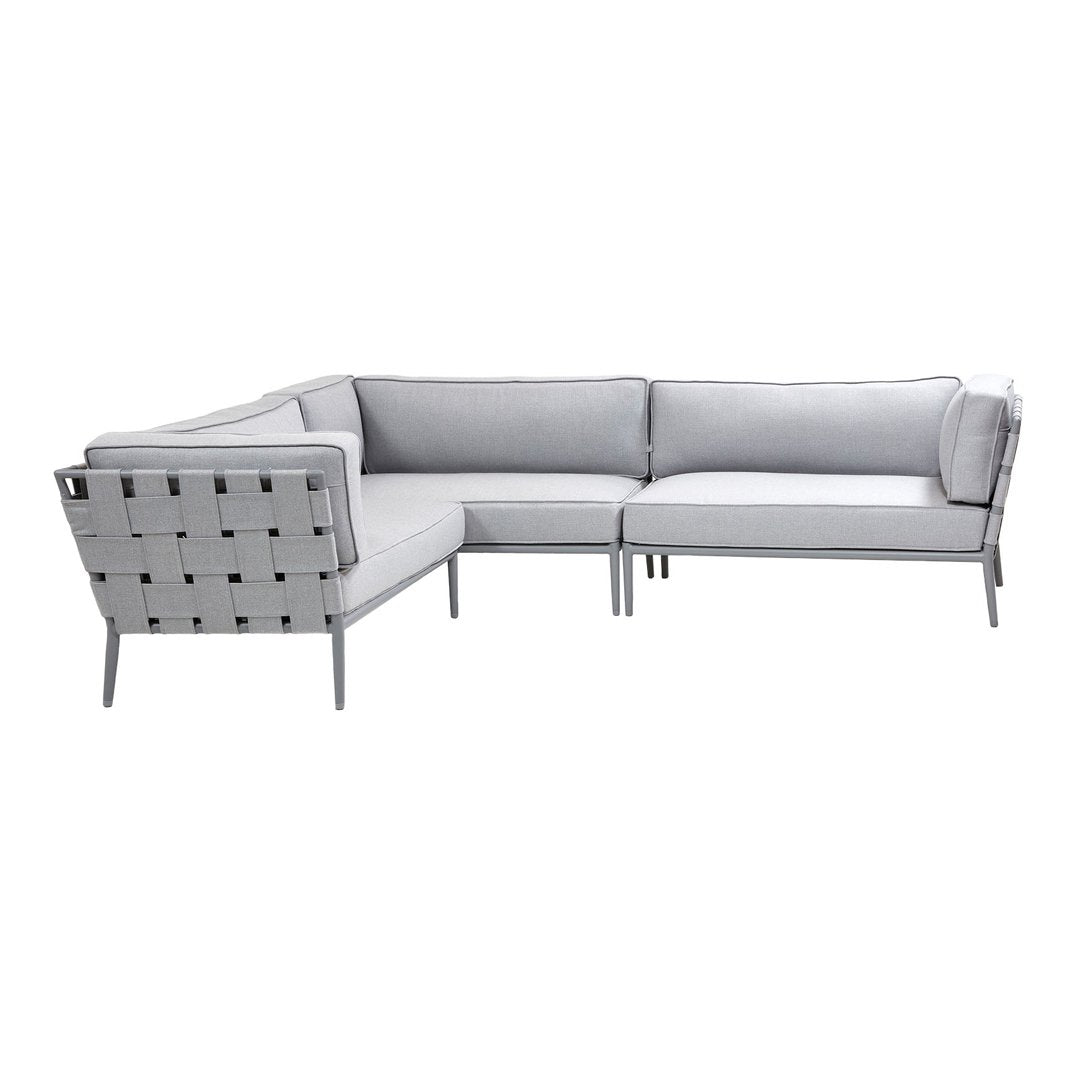 Gray outdoor sectional sofa with sleek, modern lines and a woven pattern on the backrest.