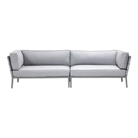 Gray sofa with a sleek modern design, featuring solid gray cushions and contrasting black trim. Perfect for contemporary decor.