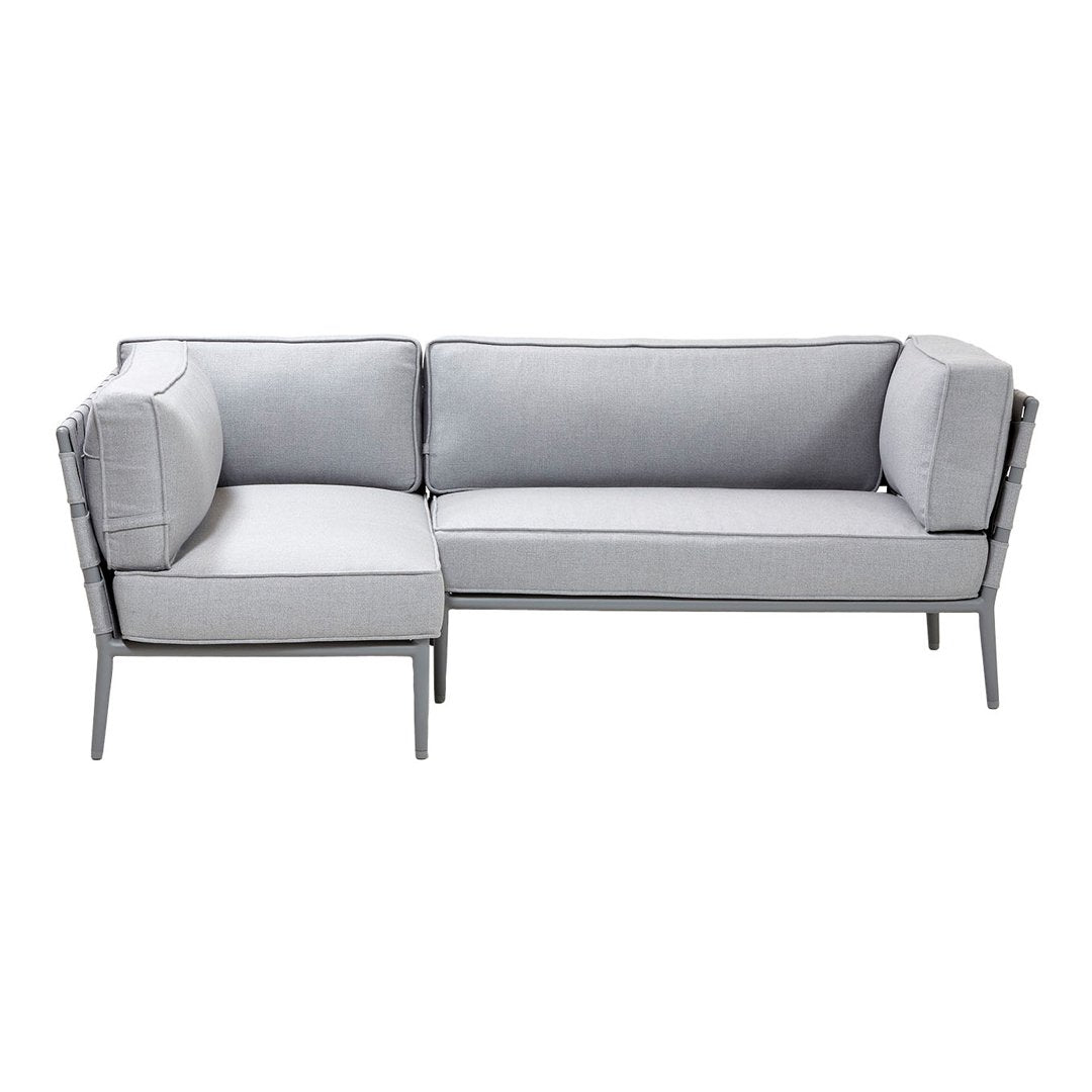 Gray modern sectional sofa with sleek lines and plush cushions, featuring a minimalist design and neutral color palette.