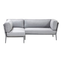 Gray modern sectional sofa with sleek lines and plush cushions, featuring a minimalist design and neutral color palette.