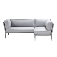 Gray sectional sofa with clean lines and subtle pattern, featuring plush cushions and sleek metal legs.