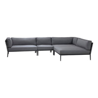 Gray sectional sofa with sleek black frame and modern cushion design, perfect for contemporary living spaces.