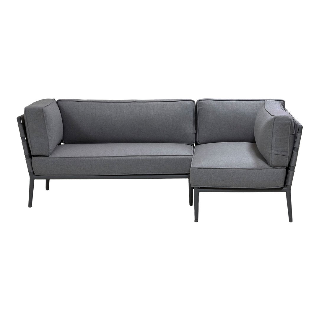 Gray sectional sofa with a modern design and clean lines, featuring a sleek black metal frame. Perfect for contemporary spaces.