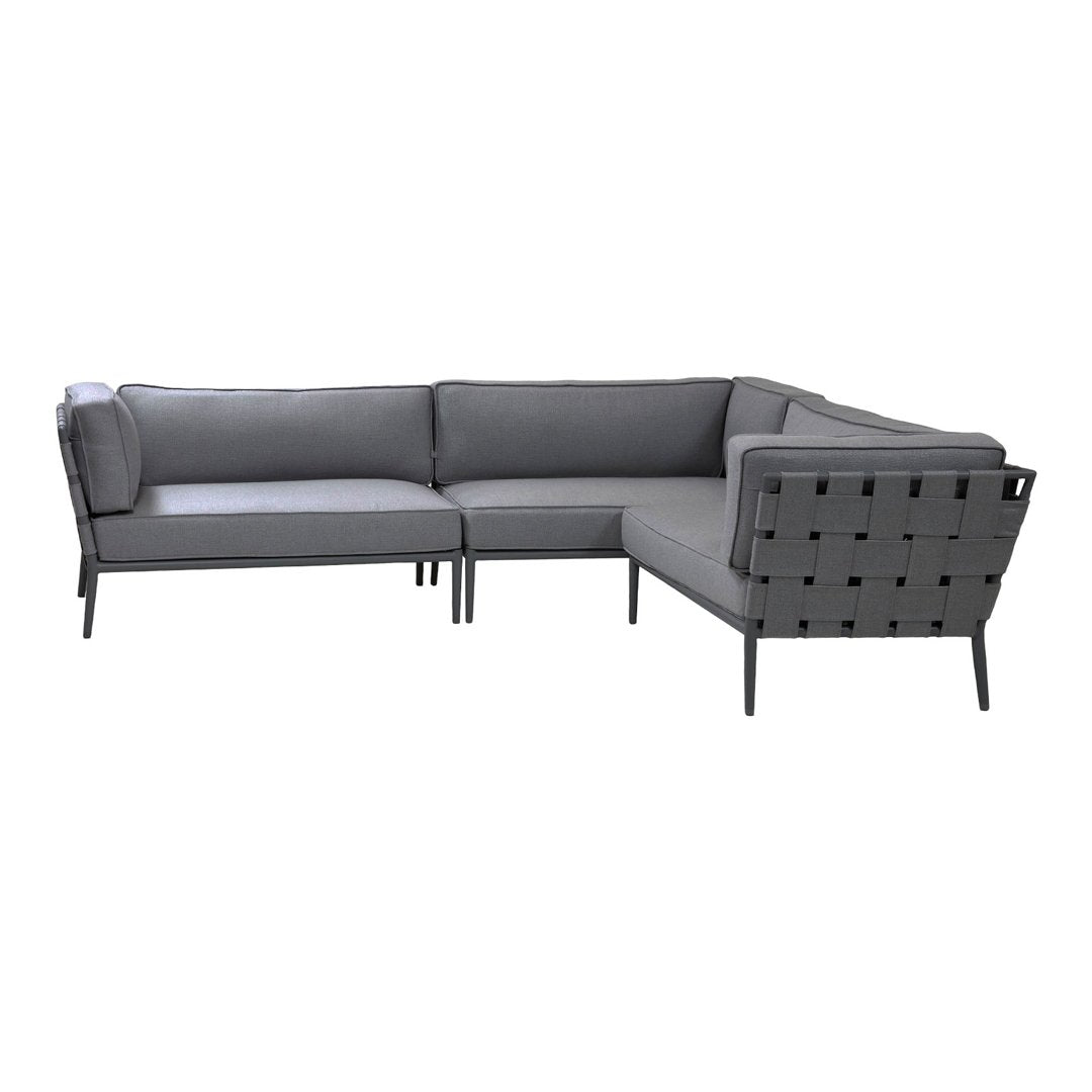 Gray outdoor sectional sofa with sleek cushions and a modern lattice pattern on the sides. Perfect for patio styling.