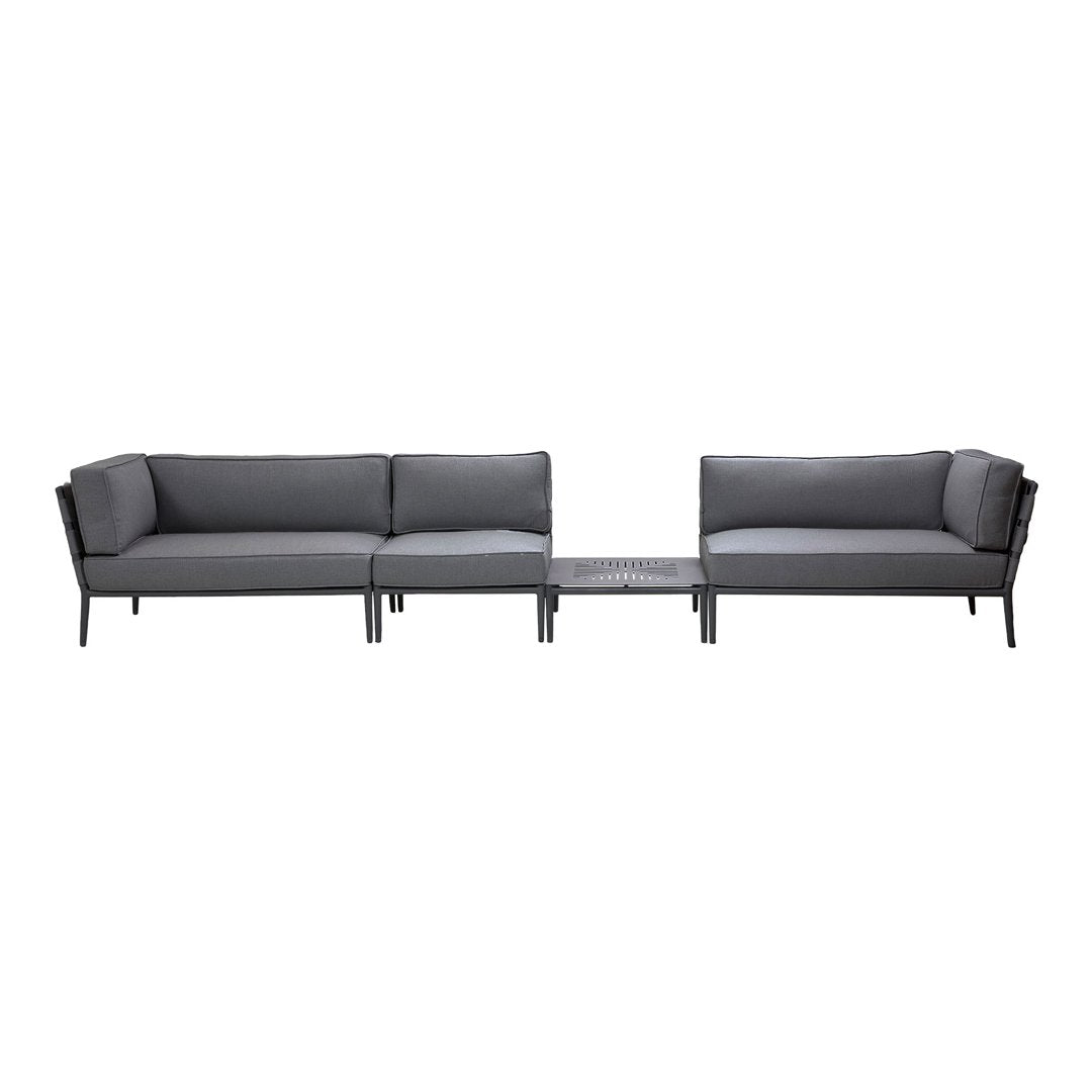 Modern outdoor sofa set featuring grey cushions and a sleek black metal frame, complemented by a glass-top coffee table.