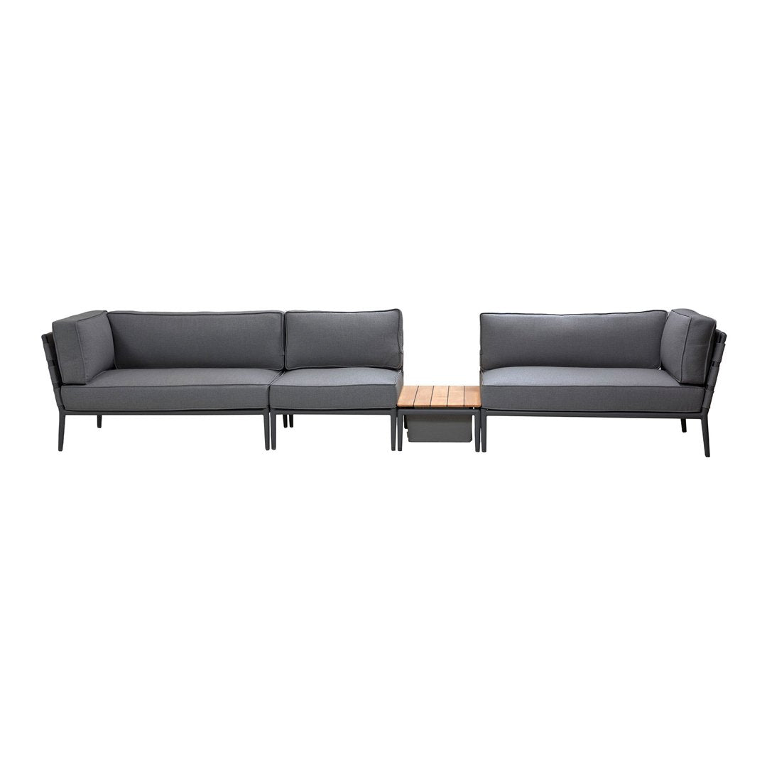 Gray outdoor sectional sofa with plush cushions and a wooden coffee table, featuring a sleek modern design.