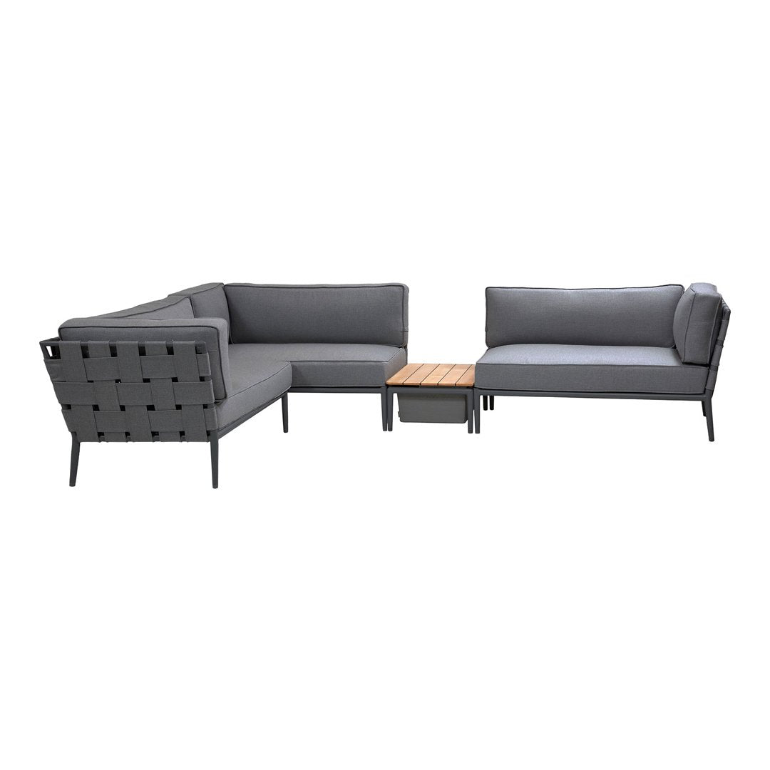 Modern grey sectional sofa set with a textured pattern and natural wood accent table. Ideal for stylish outdoor spaces.
