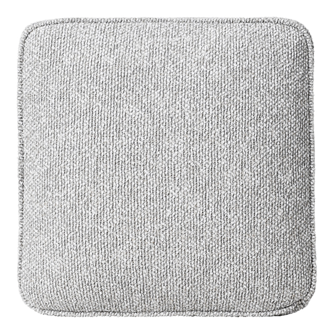 Textured light gray cushion with a subtle pattern, featuring a square shape and contrasting stitched edging.