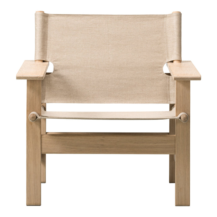 Light beige fabric chair with a natural wood frame, featuring a minimalist, modern design. Perfect for any decor style.
