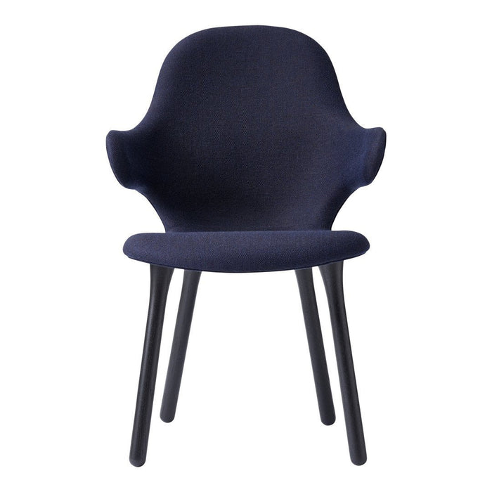 Navy blue upholstered chair with a smooth finish and sleek black wooden legs. Modern, minimalist design.