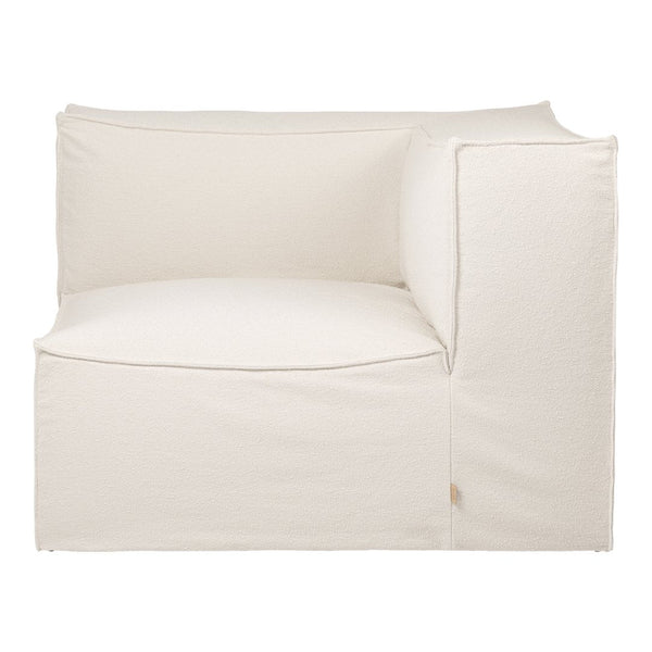 Cream-colored upholstered corner sofa with a minimalist design. Perfect for modern, neutral interiors.