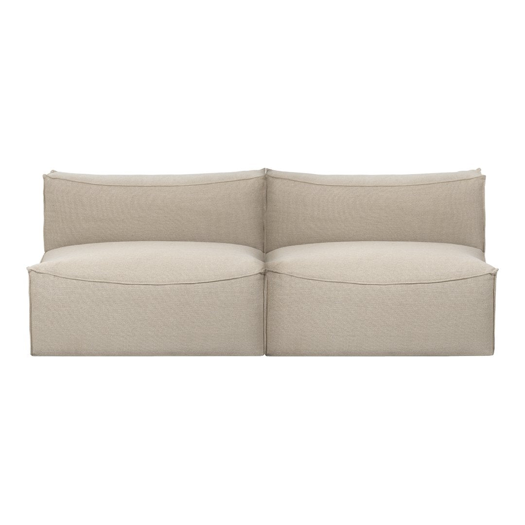Beige modular sofa with smooth, solid fabric and simplistic, modern design for a cozy living space.