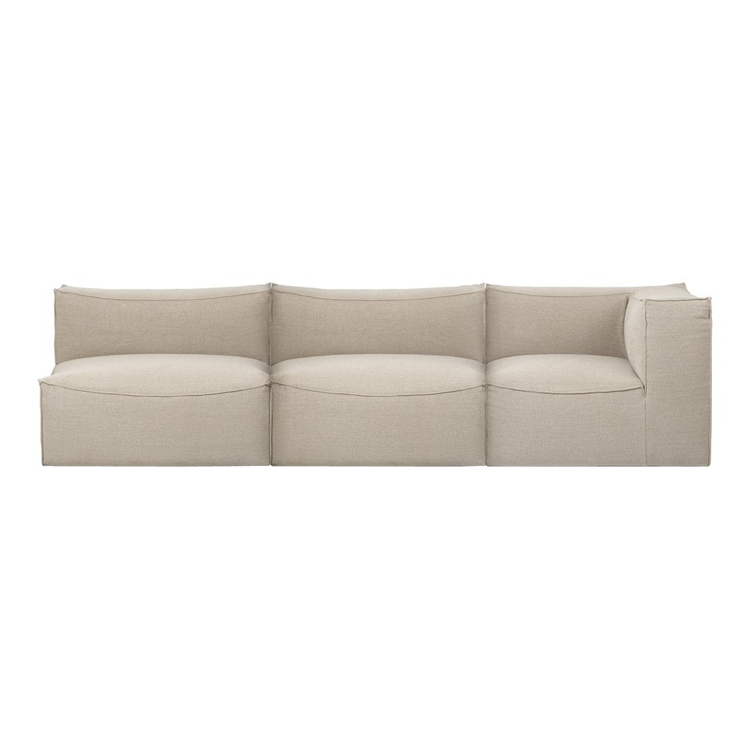 Beige modular sofa with a smooth fabric texture and curved cushions, perfect for modern living spaces.