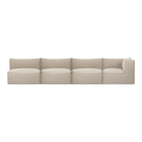 Beige sectional sofa with smooth, rounded cushions and a minimalist design. Perfect for modern living spaces.