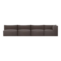 Modern modular sofa in a solid dark brown fabric with smooth, rounded cushions for a sleek, minimalist look.