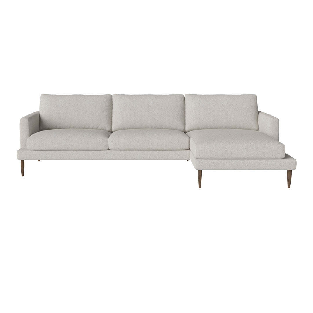 Light gray sectional sofa with a clean, minimalist design and soft fabric. Features a right-facing chaise lounge.