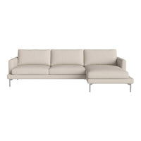 Light beige modern sectional sofa with sleek lines and minimalist design, featuring solid color upholstery.