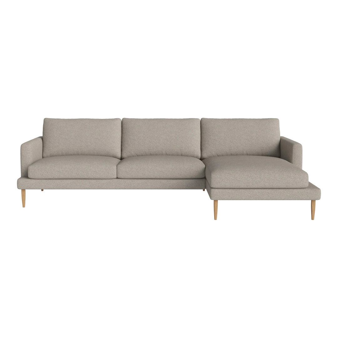 Light gray sectional sofa with a modern design and soft fabric, featuring clean lines and wooden legs.