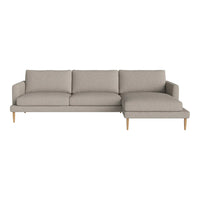 Light gray sectional sofa with a modern design and soft fabric, featuring clean lines and wooden legs.