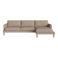 Beige sectional sofa with clean lines and textured fabric, featuring a modern design and wooden legs. Perfect for stylish spaces.