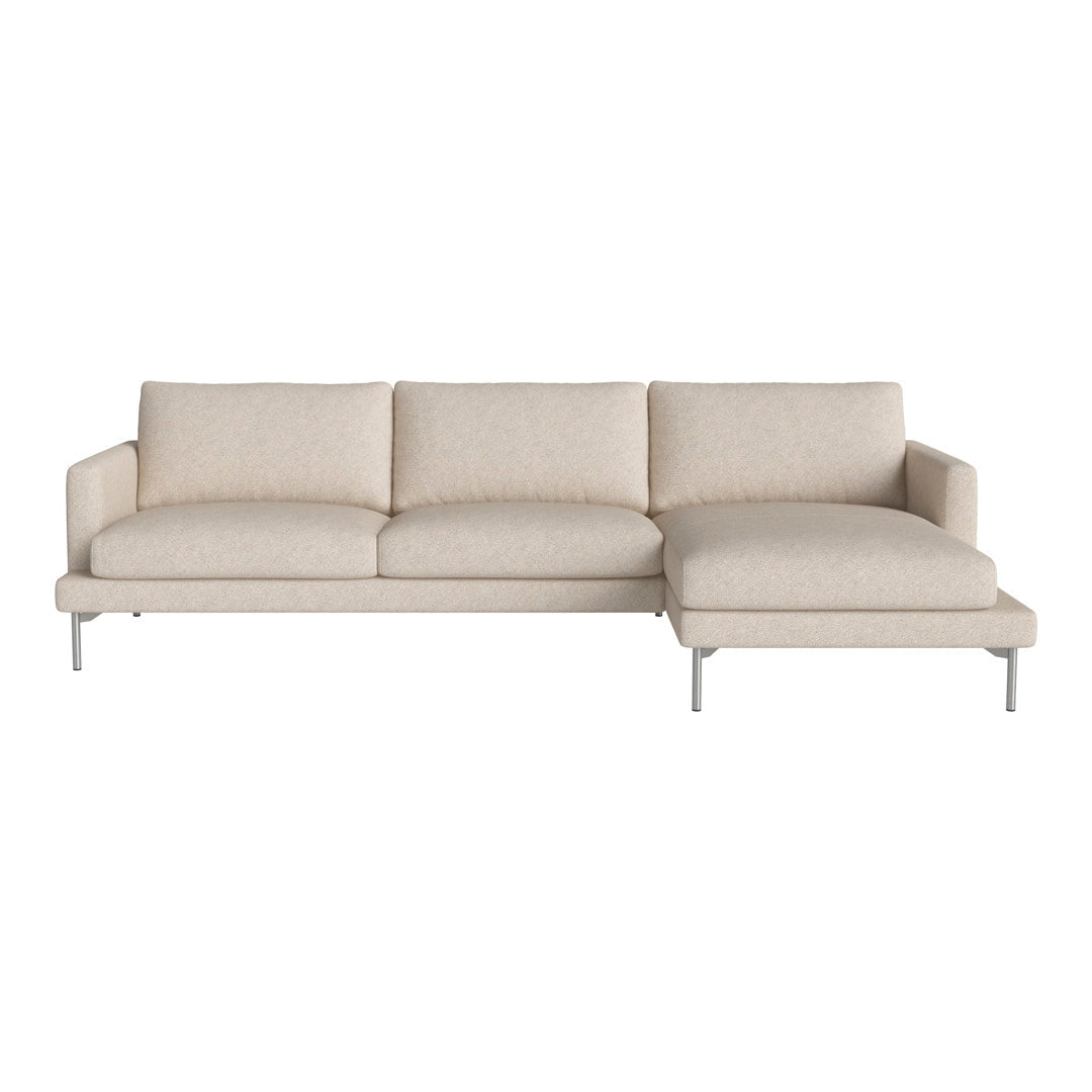 Light beige sectional sofa with a smooth, minimally textured fabric and sleek silver legs, ideal for modern decor.