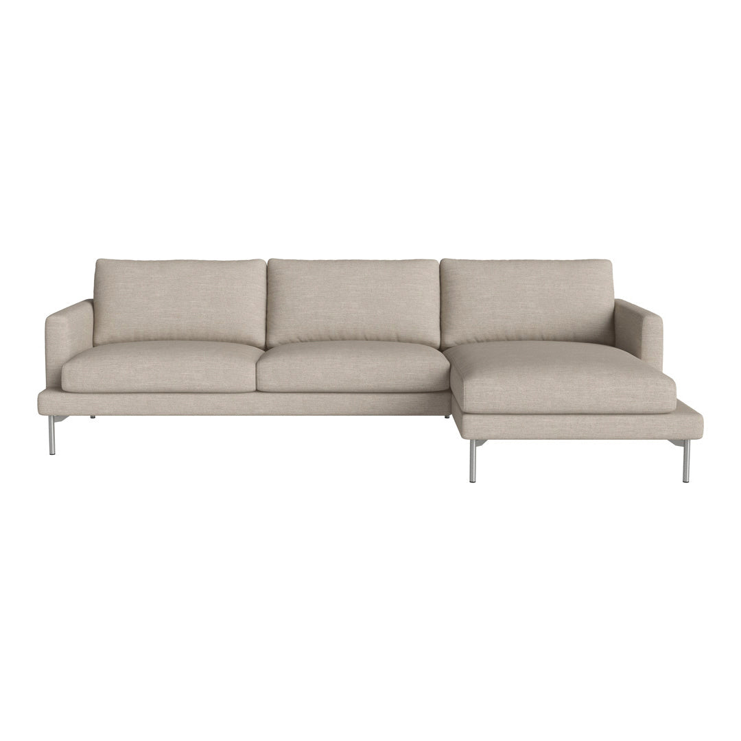 Light beige sectional sofa with clean lines, featuring solid-colored upholstery and modern metal legs.