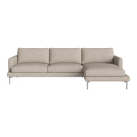 Light beige sectional sofa with clean lines, featuring solid-colored upholstery and modern metal legs.