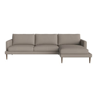 Light taupe sectional sofa with clean lines and smooth fabric, complemented by wooden legs for a modern touch.