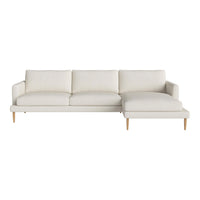 Light cream sectional sofa with smooth upholstery and natural wood legs, perfect for modern décor.