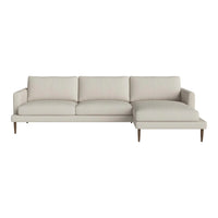 Light beige sectional sofa with clean lines and a textured fabric, featuring minimalist design and wooden legs.