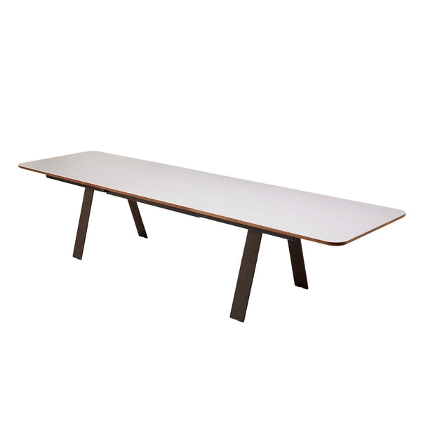 White rectangular table with sleek edges and dark wood legs, featuring a minimalist design and smooth finish.