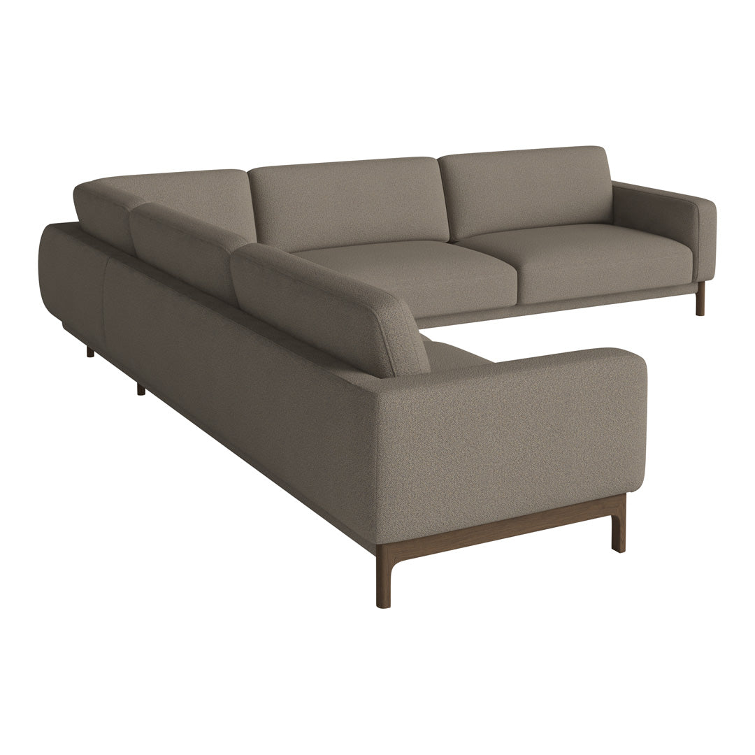 Light gray modern sectional sofa with clean lines and seamless fabric, featuring a minimalist design and dark wooden legs.