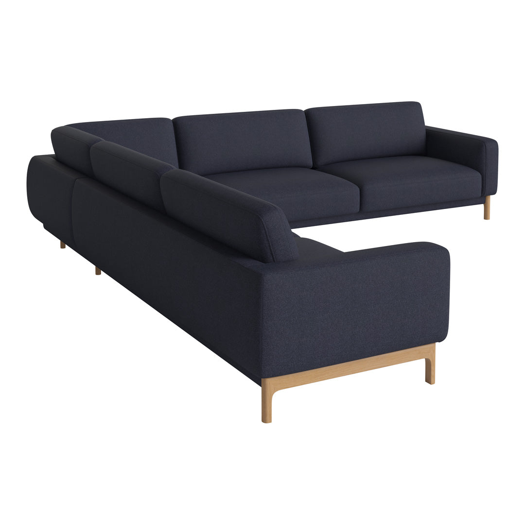 Dark navy blue sectional sofa with a clean design and light wooden legs, perfect for modern interiors.