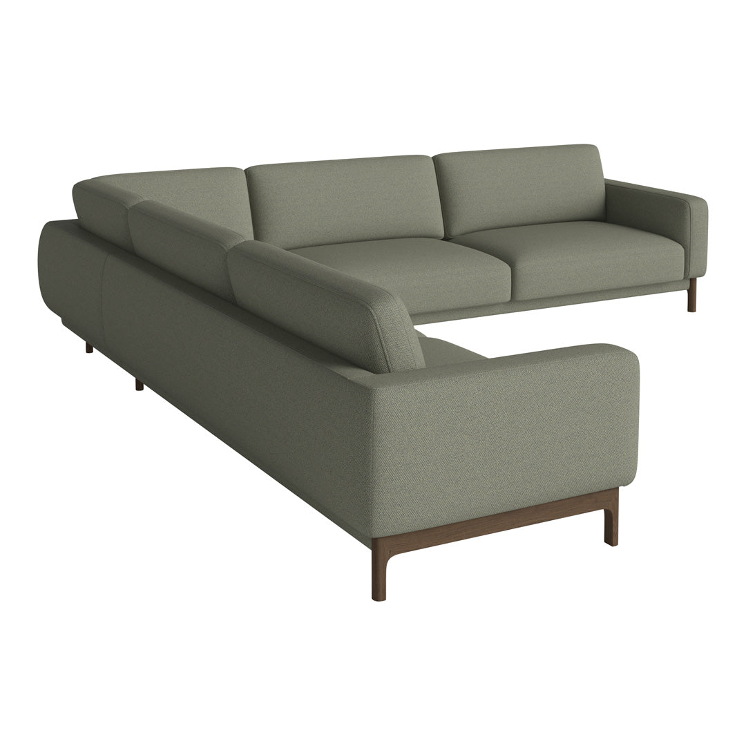 Stylish two-tone sectional sofa in muted green fabric with clean lines and modern brown legs. Ideal for contemporary decor.