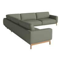 Sleek gray sectional sofa with a modern design, featuring soft fabric and light wooden legs.