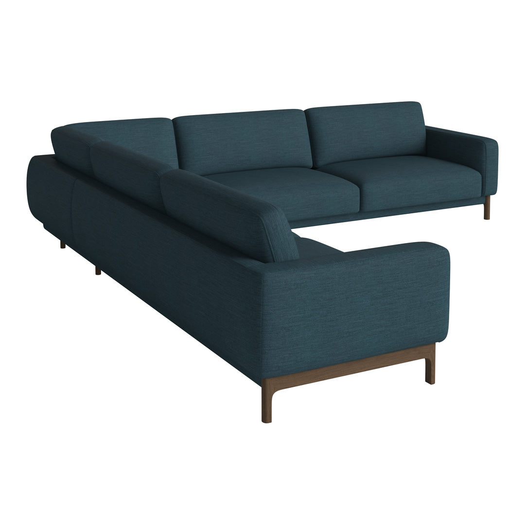 Teal sectional sofa with a sleek design and subtle textured fabric, complemented by warm wooden legs.