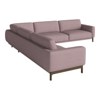 Light mauve sectional sofa featuring smooth fabric and minimalist design with wooden legs. Perfect for modern decor.