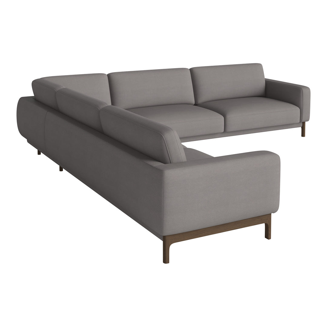 Gray sectional sofa with a smooth, modern fabric and minimalistic wooden legs, ideal for contemporary living spaces.