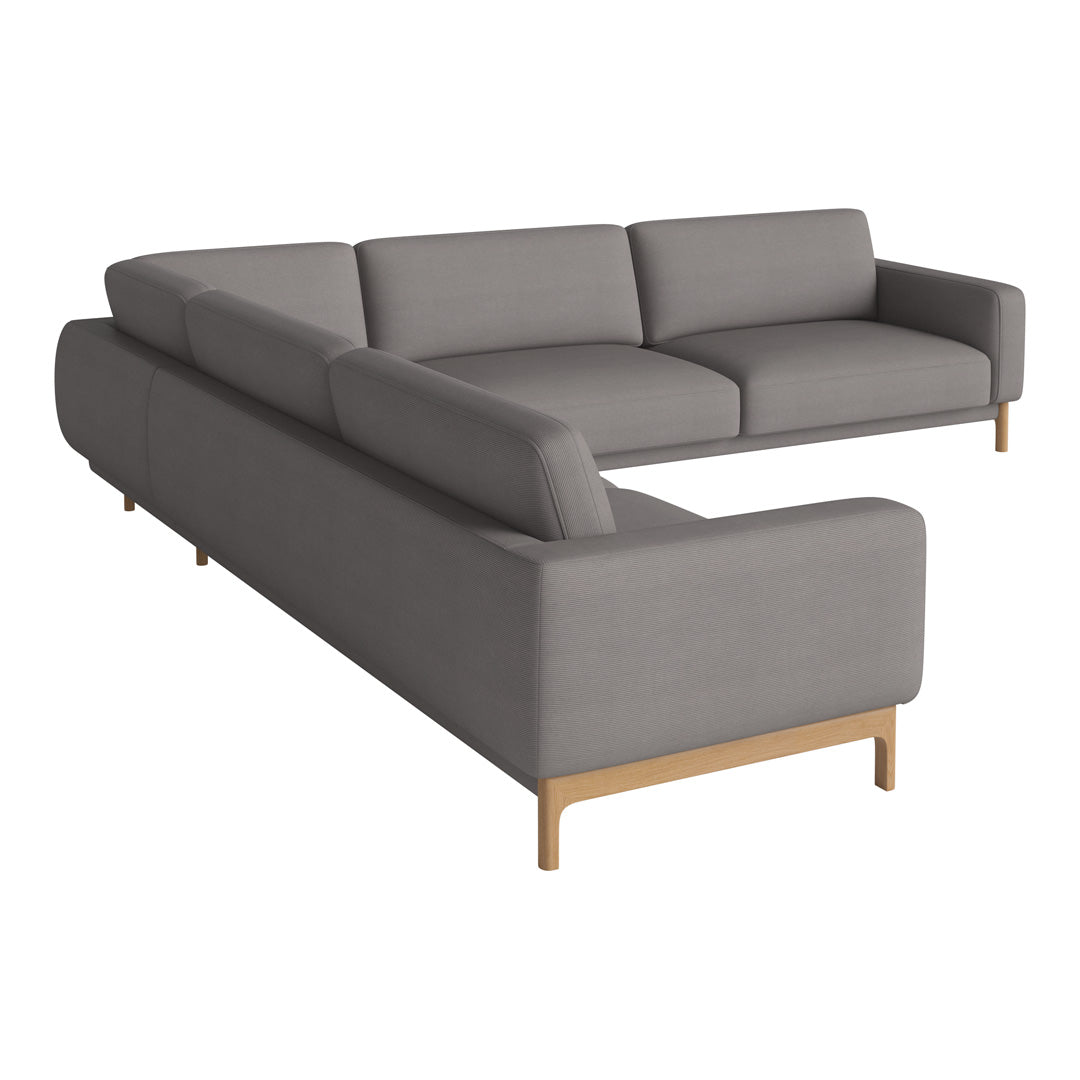 Gray sectional sofa with a minimalist design and wooden legs, featuring smooth upholstery and clean lines.