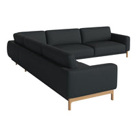 L-shaped sectional sofa in solid black fabric with minimalist design and light wood legs. Perfect for modern decor.
