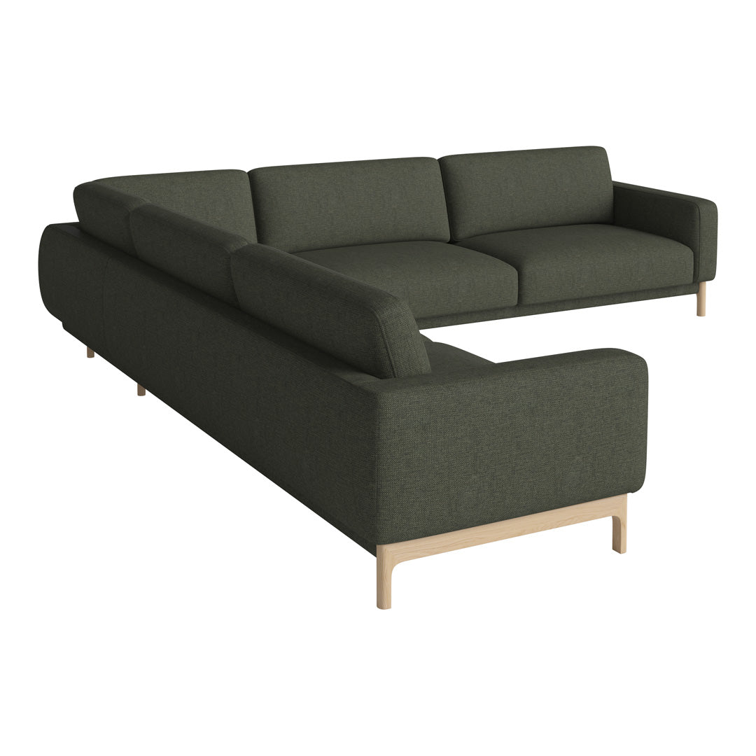 Dark green corner couch with a minimalist design and light wooden legs, featuring a smooth, textured fabric pattern.