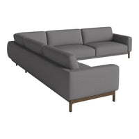 Gray sectional sofa with sleek lines and a modern design, featuring a subtle fabric texture and dark wood legs.