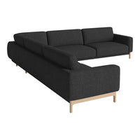 Modern black upholstered sectional couch with clean lines and minimalistic wooden legs. Perfect for contemporary living spaces.