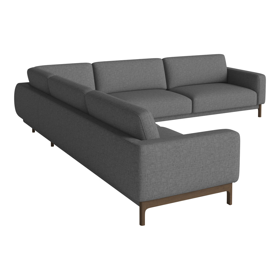 Gray sectional sofa with sleek modern design and subtle texture, featuring a minimalist pattern and dark wooden legs.