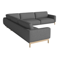 Gray sectional sofa with a sleek, minimalist design and light wooden legs, perfect for modern interiors.
