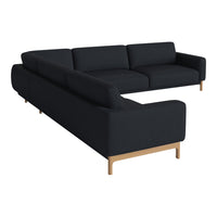 Black sectional sofa with sleek lines and a modern design, featuring a minimalist aesthetic and light wood legs.